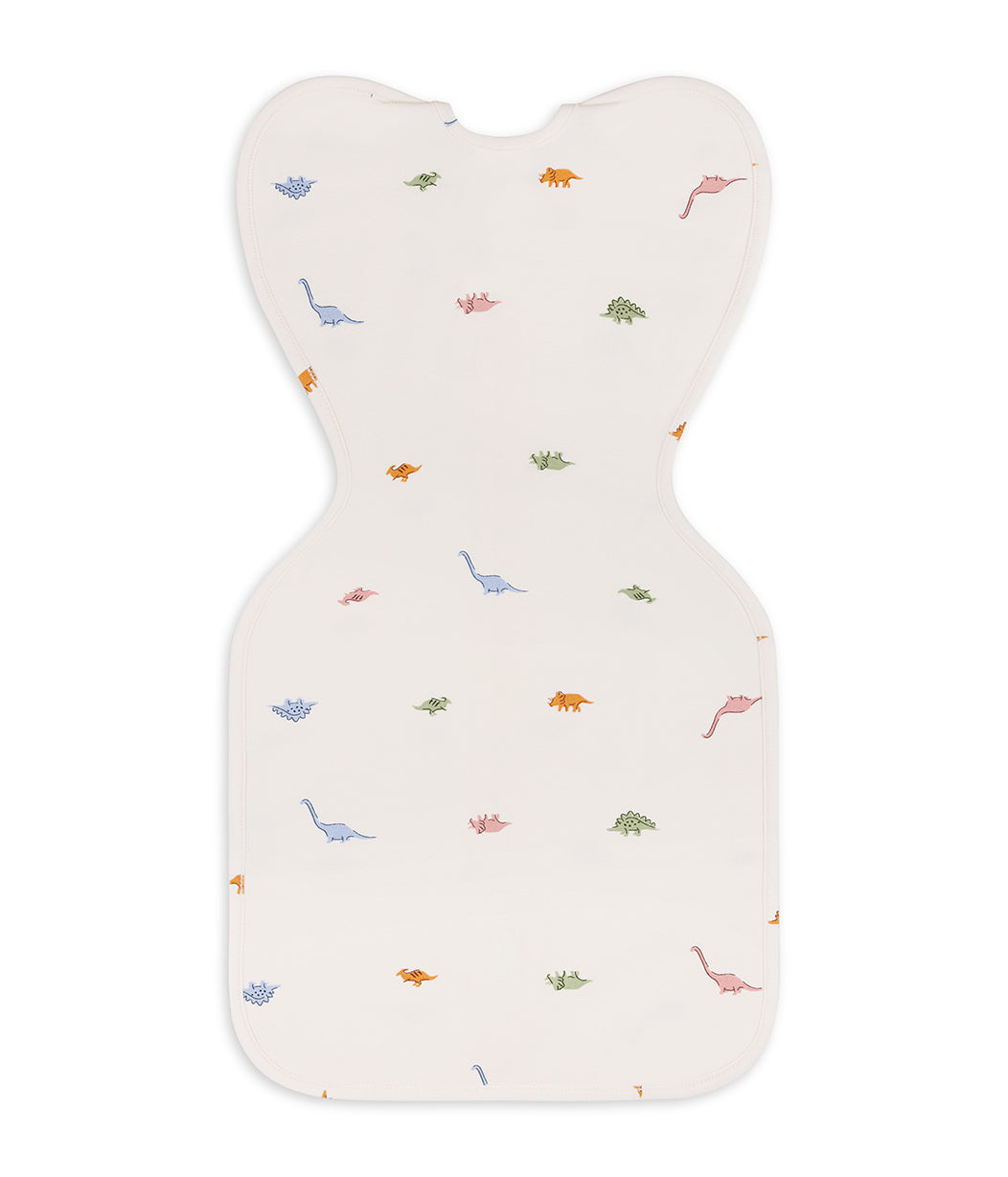Sacco nanna Swaddle Up™ per neonati 1.0 TOG in cotone color crema Dino Snore